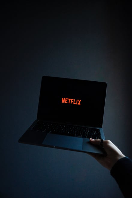 MacBook displaying Netflix Logo